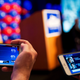 Supporters watch returns come in on their phones while attending the election night party of Democratic candidate for 6th congressional district Jon Ossoff in Atlanta, Tuesday, June 20, 2017. (AP Photo/David Goldman)